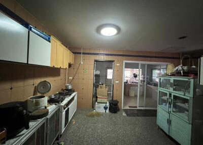 Industrial-style kitchen with storage cabinets and cooking equipment