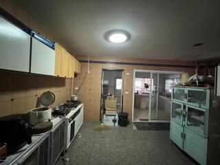 Industrial-style kitchen with storage cabinets and cooking equipment