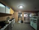 Industrial-style kitchen with storage cabinets and cooking equipment