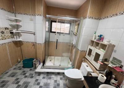 bathroom with shower and toilet