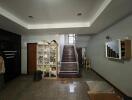 Living room with staircase and storage unit