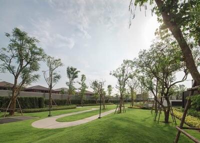 Beautiful landscaped garden with walking paths and trees