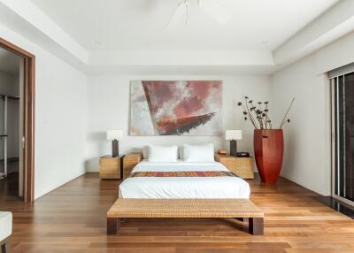 Modern bedroom with contemporary decor and wooden flooring