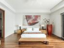 Modern bedroom with contemporary decor and wooden flooring