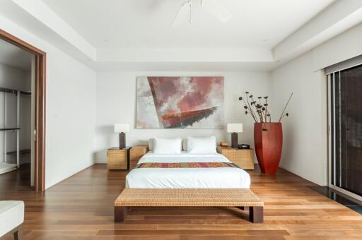 Modern bedroom with contemporary decor and wooden flooring