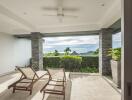 Spacious balcony with lounge chairs and a view