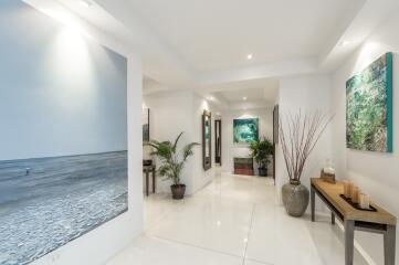 Modern hallway with artwork and plants