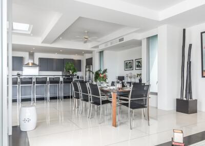 Modern dining area connected to an open kitchen