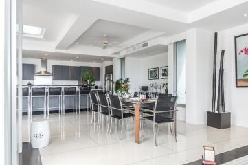 Modern dining area connected to an open kitchen