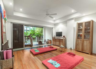 Spacious living room with hardwood floors and minimalist decor