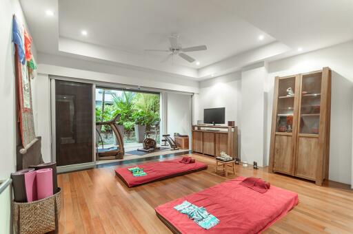 Spacious living room with hardwood floors and minimalist decor