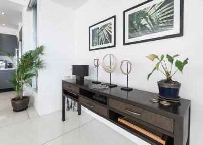 Modern living room with plant decor and a console table