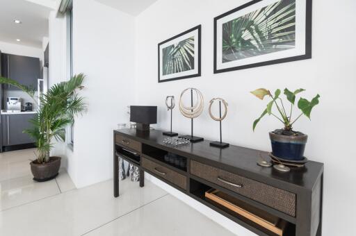 Modern living room with plant decor and a console table