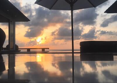 Scenic outdoor patio with ocean view at sunset