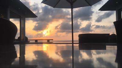 Scenic outdoor patio with ocean view at sunset