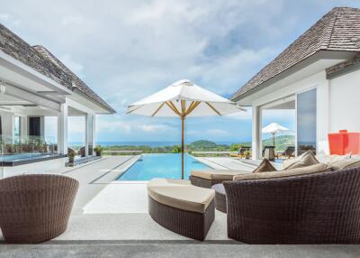 Luxurious outdoor patio with pool and ocean view