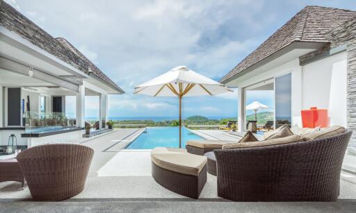 Luxurious outdoor patio with pool and ocean view