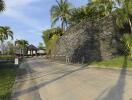 Gated entrance with lush landscaping