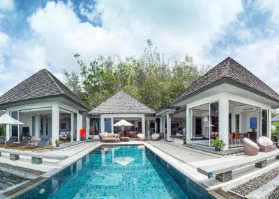 Panoramic view of a luxury villa with a swimming pool