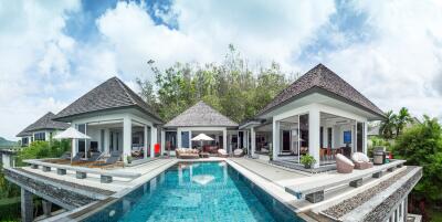 Panoramic view of a luxury villa with a swimming pool