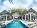 Panoramic view of a luxury villa with a swimming pool