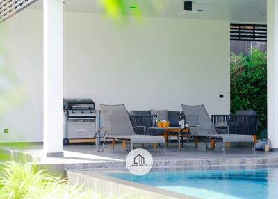 Outdoor lounge area by the pool