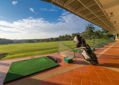 Golf course with golf driving range