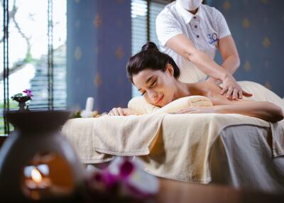 A person receiving a massage in a spa