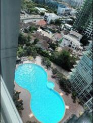 Aerial view of a residential complex with a large swimming pool