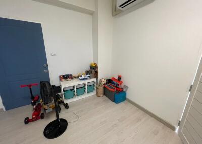 Utility room with various equipment and storage boxes