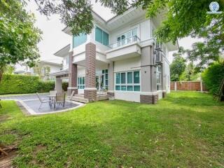 Spacious modern home with a lush green outdoor area.