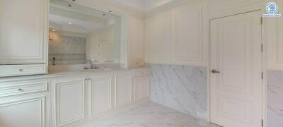 Bright white kitchen with marble accents