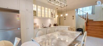 Modern kitchen with island and stairs