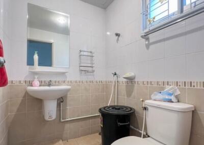 Modern, clean bathroom with sink and toilet