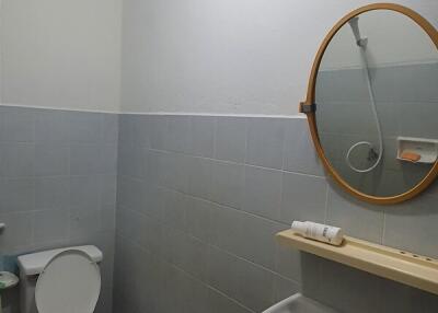 Clean and simple bathroom with white and light blue tiles