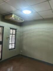 Empty bedroom with air conditioner and window