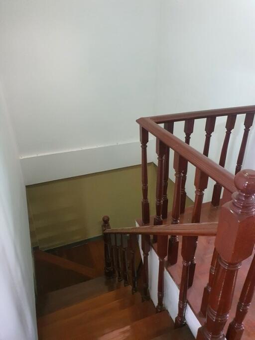 Wooden stairs with banister