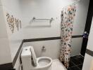 Modern bathroom with white fixtures and decorative tiles