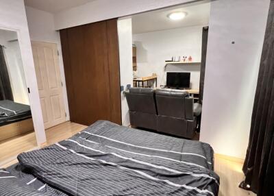 Bedroom with view into living area