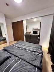 Bedroom with view into living area