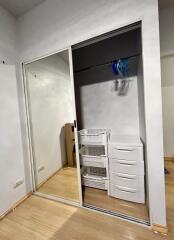 Bedroom closet with mirrored sliding doors