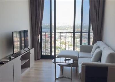 Modern living room with large window and city view