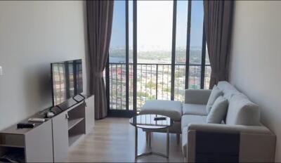 Modern living room with large window and city view