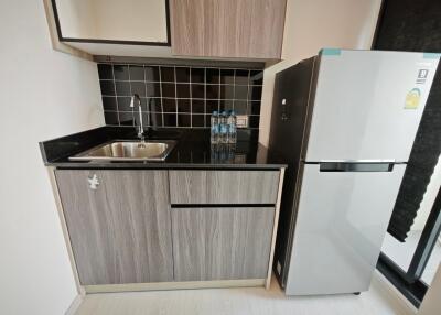 Compact kitchen with fridge and sink