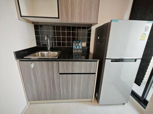 Compact kitchen with fridge and sink