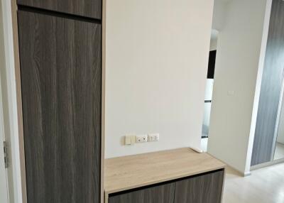 Minimalist hallway with built-in wooden cabinets