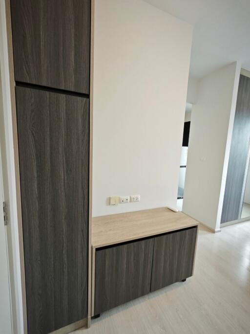 Minimalist hallway with built-in wooden cabinets