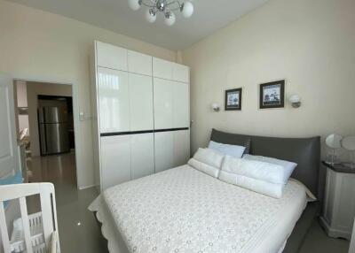 Bedroom with a double bed, wardrobe, and modern lighting