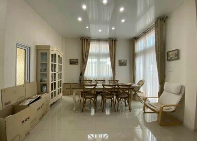 Spacious dining room with a large table and plenty of natural light