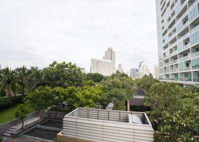 View of surroundings from the property with greenery and neighboring buildings